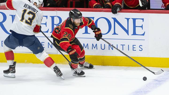 Jan 10, 2026; Ottawa, Ontario, CAN; Ottawa Senators right wing Claude Giroux (28) skates away with the puck after battling with Florida Panthers center Sam Reinhart (13) in the third period at the Canadian Tire Centre. Mandatory Credit: Marc DesRosiers-IMAGN Images