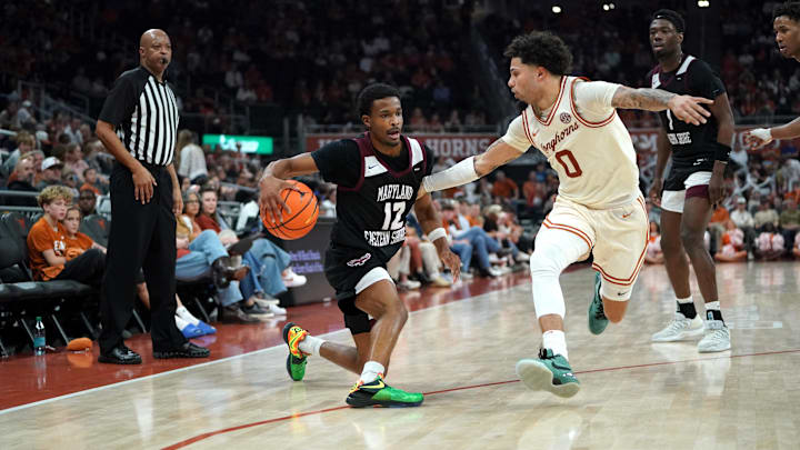 Dec 22, 2025; Austin, Texas, USA;Maryland Eastern Shore Hawks guard Justin Monden (12) dribbles against Texas Longhorns guard Jordan Pope (0) during the second half at Moody Center. Mandatory Credit: Dustin Safranek-Imagn Images