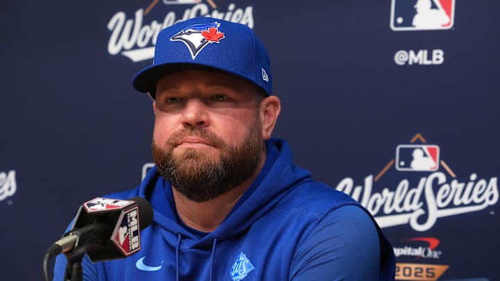 Oct 28, 2025; Los Angeles, California, USA; Toronto Blue Jays manager John Schneider (14) speaks in a press conference before game four of the 2025 MLB World Series against the Los Angeles Dodgers at Dodger Stadium. 