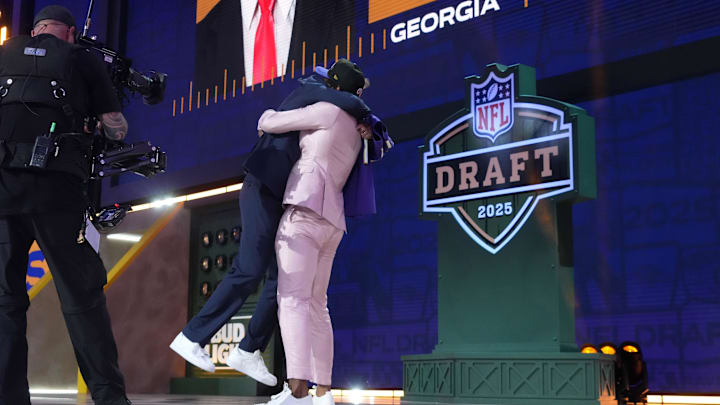 Apr 24, 2025; Green Bay, WI, USA; NFL commissioner Roger Goodell with Georgia Bulldogs safety Malaki Starks after he is selected by the Baltimore Ravens as the number 27 pick in the first round of the 2025 NFL Draft at Lambeau Field. Mandatory Credit: Kirby Lee-Imagn Images