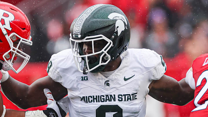 Oct 14, 2023; Piscataway, New Jersey, USA; Michigan State Spartans defensive lineman Zion Young (9) fights to make a play during the first half against the Rutgers Scarlet Knights at SHI Stadium. Mandatory Credit: Vincent Carchietta-Imagn Images