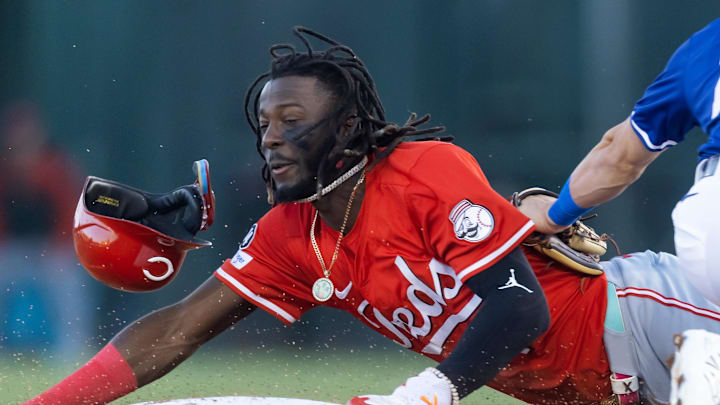 Mar 4, 2025; Phoenix, Arizona, USA; Cincinnati Reds shortstop Elly De La Cruz steals second base ahead of the tag by Los Angeles Dodgers second baseman Tommy Edman during a spring training game at Camelback Ranch-Glendale. Mandatory Credit: Mark J. Rebilas-Imagn Images