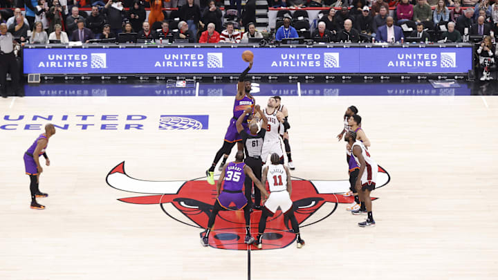 Mar 3, 2023; Chicago, Illinois, USA; Phoenix Suns center Deandre Ayton (22) gains possession during the tip-off of against Chicago Bulls center Nikola Vucevic (9) during the first half at United Center. 