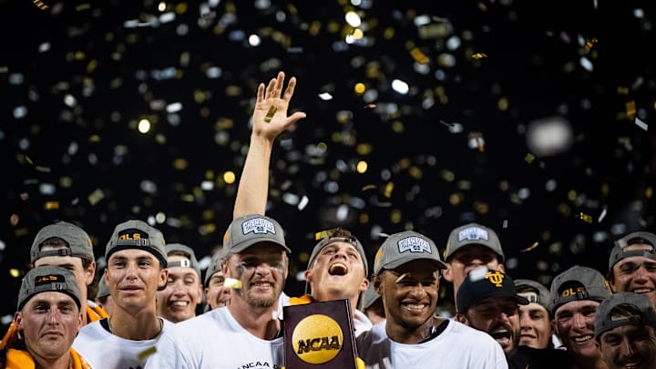 Tennessee's Drew Beam reaches up toward the confetti as players and coaches celebrate with their national championship trophy after game three of the NCAA College World Series finals between Tennessee and Texas A&M at Charles Schwab Field in Omaha, Neb., on Monday, June 24, 2024.