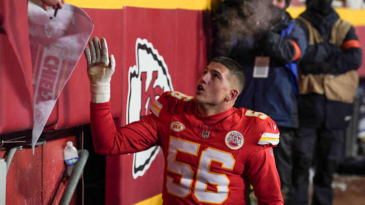 Jan 13, 2024; Kansas City, Missouri, USA; Kansas City Chiefs defensive end George Karlaftis (56) greets fans while leaving the field against the Miami Dolphins after a 2024 AFC wild card game at GEHA Field at Arrowhead Stadium. Mandatory Credit: Denny Medley-Imagn Images Jan 13, 2024; Kansas City, Missouri, USA; Kansas City Chiefs defensive end George Karlaftis (56) greets fans while leaving the field against the Miami Dolphins after a 2024 AFC wild card game at GEHA Field at Arrowhead Stadium. Mandatory Credit: Denny Medley-Imagn Images