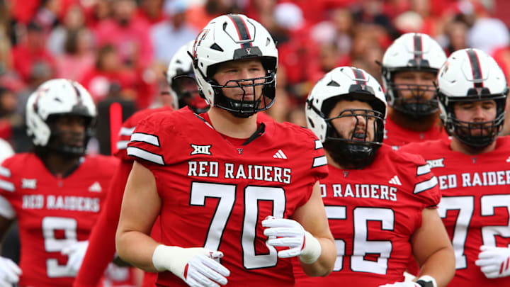 Texas Tech Red Raiders offensive lineman Jacob Ponton (70) runs onto the field in the first half against the Oklahoma State Cowboys at Jones AT&T Stadium.