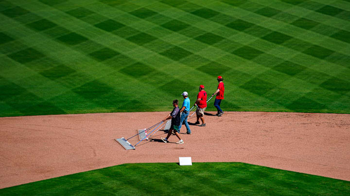 Grounds crew prepare the field for a live batting practice session during the Minnesota Twins' first full-squad workout of spring training at the Lee Health Sports Complex in Fort Myers, Fla., on Monday, Feb. 17, 2025.