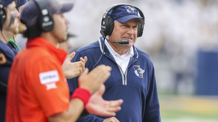 Sep 27, 2025; Morgantown, West Virginia, USA; West Virginia Mountaineers head coach Rich Rodriguez reacts on the sidelines during the third quarter against the Utah Utes at Milan Puskar Stadium. Mandatory Credit: Ben Queen-Imagn Images Sep 27, 2025; Morgantown, West Virginia, USA; West Virginia Mountaineers head coach Rich Rodriguez reacts on the sidelines during the third quarter against the Utah Utes at Milan Puskar Stadium. Mandatory Credit: Ben Queen-Imagn Images