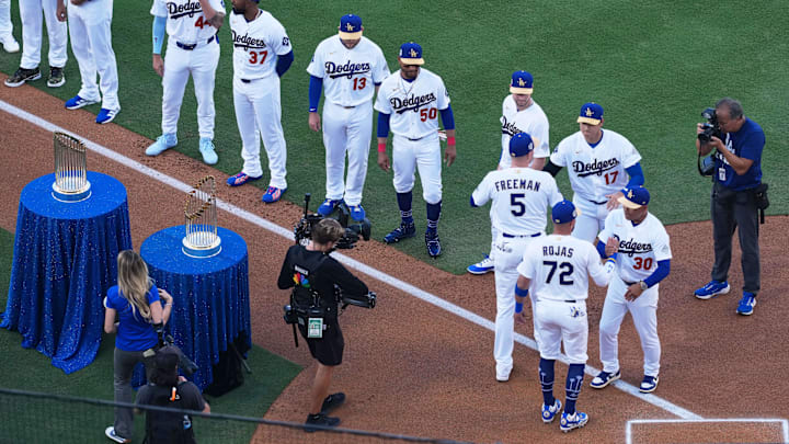 Mar 26, 2026; Los Angeles, California, USA; Los Angeles Dodgers infielders Freddie Freeman (5) and Miguel Rojas (72) greet manager Dave Roberts (30) and designated hitter Shohei Ohtani before the game against the Arizona Diamondbacks at Dodger Stadium. Mandatory Credit: Kirby Lee-Imagn Images Mar 26, 2026; Los Angeles, California, USA; Los Angeles Dodgers infielders Freddie Freeman (5) and Miguel Rojas (72) greet manager Dave Roberts (30) and designated hitter Shohei Ohtani before the game against the Arizona Diamondbacks at Dodger Stadium. Mandatory Credit: Kirby Lee-Imagn Images