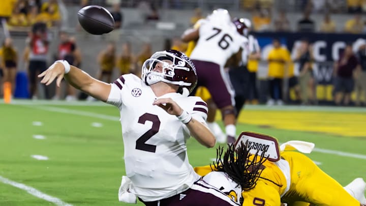 Mississippi State Bulldogs quarterback Blake Shapen (2) fumbles the ball as he is tackled by Arizona State Sun Devils defensive lineman Clayton Smith (10) in the first half at Mountain America Stadium.