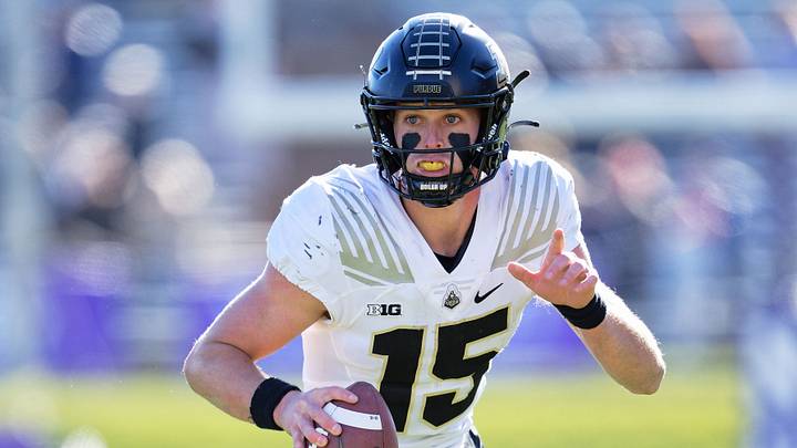 Purdue Boilermakers quarterback Ryan Browne (15) runs with the ball.