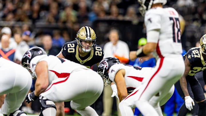 Nov 10, 2024; New Orleans, Louisiana, USA;   New Orleans Saints linebacker Pete Werner (20) stares down Atlanta Falcons quarterback Kirk Cousins (18) during the first half at Caesars Superdome. Mandatory Credit: Stephen Lew-Imagn Images