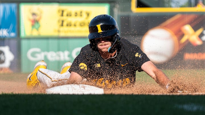 Iowa's Miles Risley slides into third base during game 2 of Iowa vs. Oregon State baseball at Principal Park on May 10, 2025, in Des Moines.