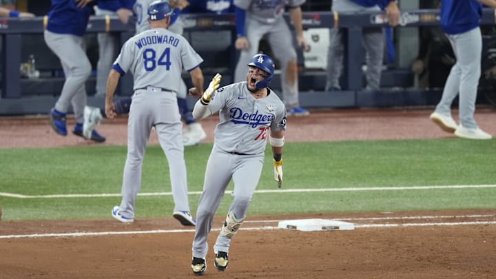 Los Angeles Dodgers second baseman Miguel Rojas (72) celebrates as he runs the bases after hitting a home run against the Toronto Blue Jays in the ninth inning during game seven of the 2025 MLB World Series at Rogers Centre on Saturday. Los Angeles Dodgers second baseman Miguel Rojas (72) celebrates as he runs the bases after hitting a home run against the Toronto Blue Jays in the ninth inning during game seven of the 2025 MLB World Series at Rogers Centre on Saturday.