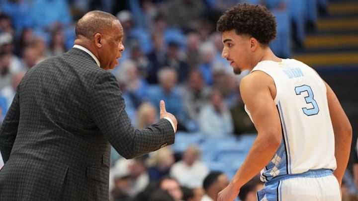 Jan 21, 2026; Chapel Hill, North Carolina, USA; North Carolina Tar Heels head coach Hubert Davis with guard Derek Dixon (3) in the first half at Dean E. Smith Center. Mandatory Credit: Bob Donnan-Imagn Images