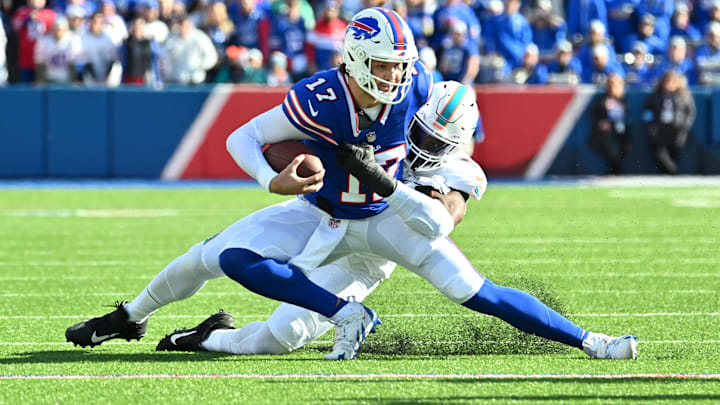 Buffalo Bills quarterback Josh Allen (17) is tackled by Miami Dolphins linebacker Emmanuel Ogbah (91) in the first quarter at Highmark Stadium. 