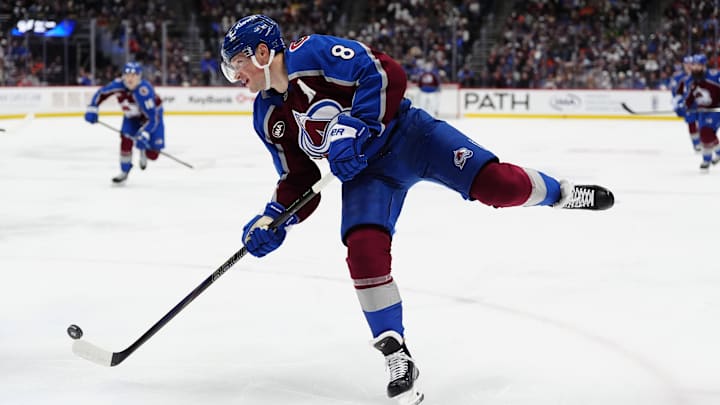 Jan 23, 2026; Denver, Colorado, USA; Colorado Avalanche defenseman Cale Makar (8) shoots the puck in the second period against the Philadelphia Flyers at Ball Arena. Mandatory Credit: Ron Chenoy-Imagn Images