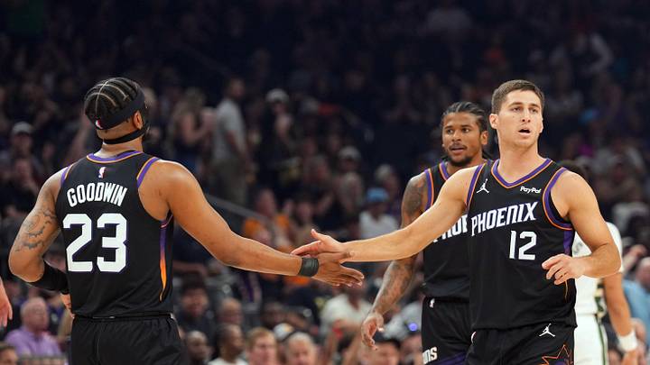 Mar 21, 2026; Phoenix, Arizona, USA; Phoenix Suns guard Jordan Goodwin (23) and Phoenix Suns guard Collin Gillespie (12) slap hands against the Milwaukee Bucks during the first half at Mortgage Matchup Center. Mandatory Credit: Joe Camporeale-Imagn Images Mar 21, 2026; Phoenix, Arizona, USA; Phoenix Suns guard Jordan Goodwin (23) and Phoenix Suns guard Collin Gillespie (12) slap hands against the Milwaukee Bucks during the first half at Mortgage Matchup Center. Mandatory Credit: Joe Camporeale-Imagn Images