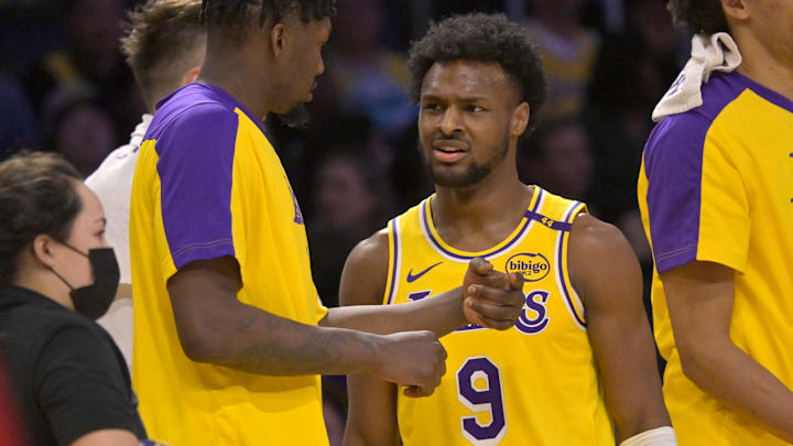 Mar 19, 2025; Los Angeles, California, USA;  Los Angeles Lakers guard Bronny James (9) talks with forward Dorian Finney-Smith (17) during a time out in the second half against the Denver Nuggets at Crypto.com Arena.