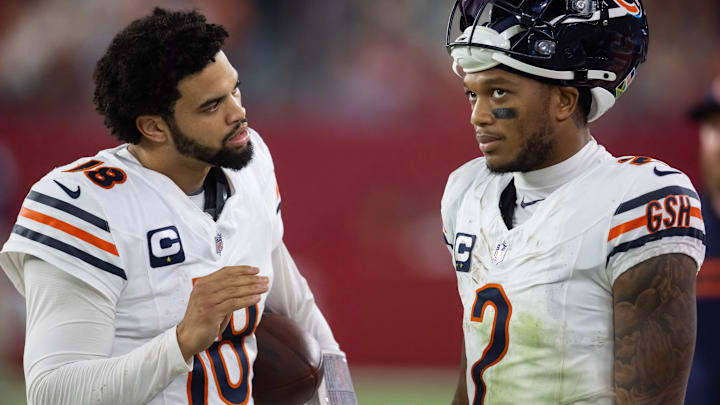 Nov 3, 2024; Glendale, Arizona, USA; Chicago Bears quarterback Caleb Williams (18) talks with wide receiver DJ Moore (2) against the Arizona Cardinals at State Farm Stadium. Mandatory Credit: Mark J. Rebilas-Imagn Images Nov 3, 2024; Glendale, Arizona, USA; Chicago Bears quarterback Caleb Williams (18) talks with wide receiver DJ Moore (2) against the Arizona Cardinals at State Farm Stadium. Mandatory Credit: Mark J. Rebilas-Imagn Images