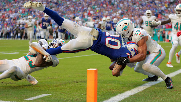 Miami Dolphiins cornerback Jack Jones (23) and safety Minkah Fitzpatrick (29) tackle Khalil Shakir short of the goal line on a two-point conversion attempt during the second half at Hard Rock Stadium.