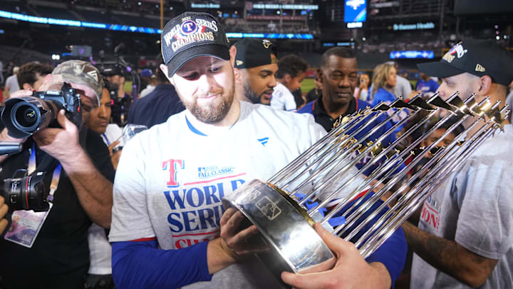 South Carolina baseball alum Jordan Montgomery with the World Series trophy after winning the title this year with the Texas Rangers