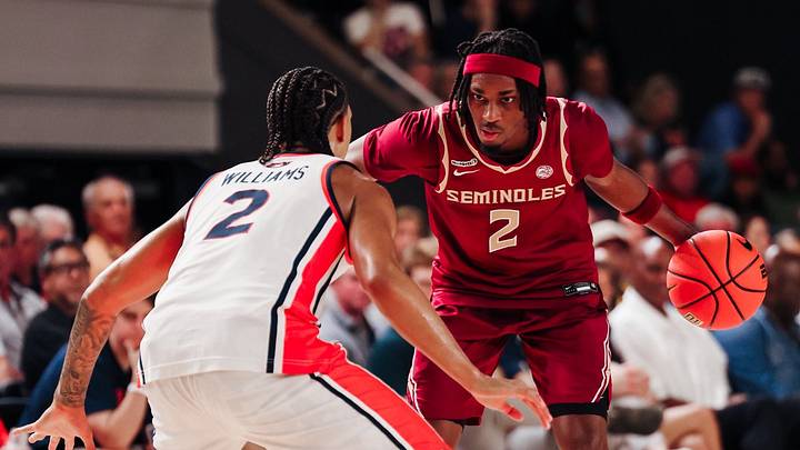 Florida State Seminoles guard Anthony Robinson II against Caleb Williams of the Auburn Tigers in the Ballin' In Boutwell exhibition Florida State Seminoles guard Anthony Robinson II against Caleb Williams of the Auburn Tigers in the Ballin' In Boutwell exhibition