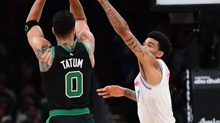 Apr 2, 2025; Boston, Massachusetts, USA; Boston Celtics forward Jayson Tatum (0) shoots over Miami Heat center Kel'el Ware (7) during the first half at TD Garden. Mandatory Credit: Bob DeChiara-Imagn Images Apr 2, 2025; Boston, Massachusetts, USA; Boston Celtics forward Jayson Tatum (0) shoots over Miami Heat center Kel'el Ware (7) during the first half at TD Garden. Mandatory Credit: Bob DeChiara-Imagn Images