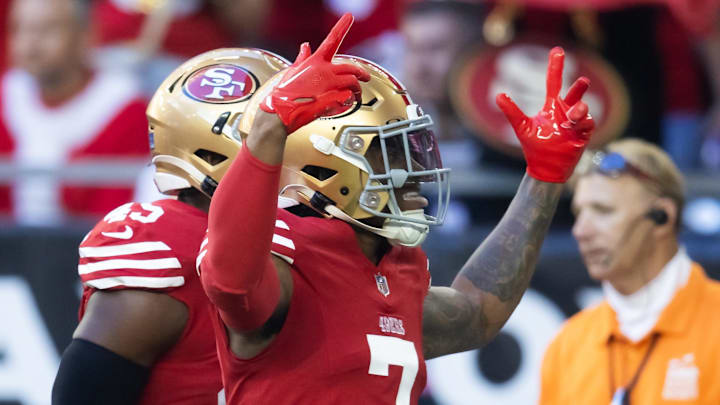 Dec 17, 2023; Glendale, Arizona, USA; San Francisco 49ers cornerback Charvarius Ward (7) celebrates after running back an interception for a touchdown during the first quarter against the Arizona Cardinals at State Farm Stadium. Mandatory Credit: Mark J. Rebilas-Imagn Images