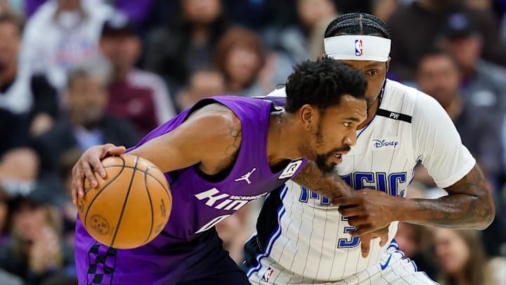 Feb 5, 2025; Sacramento, California, USA; Sacramento Kings guard Malik Monk (0) controls the ball against Orlando Magic guard Kentavious Caldwell-Pope (3) during the first quarter at Golden 1 Center. Mandatory Credit: Sergio Estrada-Imagn Images Feb 5, 2025; Sacramento, California, USA; Sacramento Kings guard Malik Monk (0) controls the ball against Orlando Magic guard Kentavious Caldwell-Pope (3) during the first quarter at Golden 1 Center. Mandatory Credit: Sergio Estrada-Imagn Images