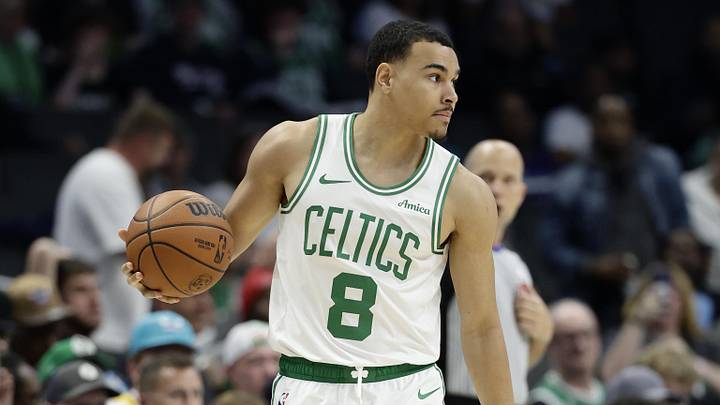 Mar 29, 2026; Charlotte, North Carolina, USA; Boston Celtics guard John Tonje (8) controls the ball as time runs down in the second half against the Charlotte Hornets at Spectrum Center. Mandatory Credit: Brian Westerholt-Imagn Images