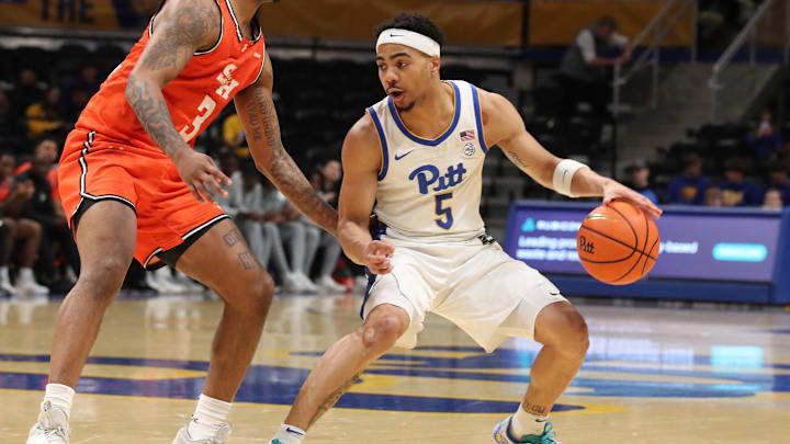 Dec 21, 2024; Pittsburgh, Pennsylvania, USA;  Pittsburgh Panthers guard Ishmael Leggett (5) handles the ball against Sam Houston State Bearkats guard Lamar Wilkerson (3) during the second half at the Petersen Events Center. Mandatory Credit: Charles LeClaire-Imagn Images
