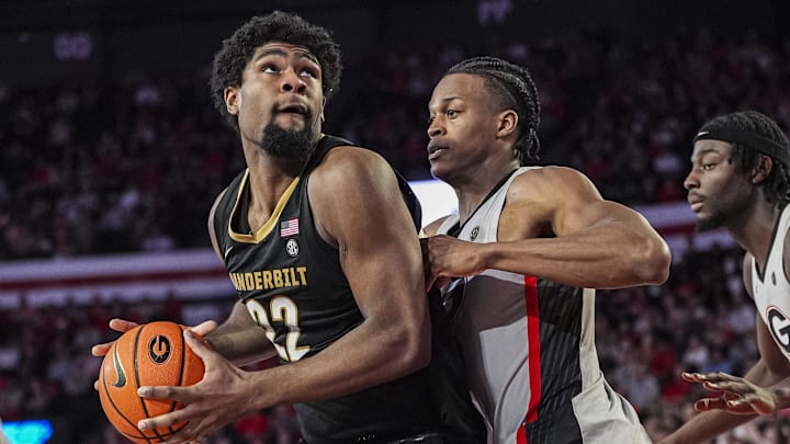 Vanderbilt Commodores forward Jaylen Carey (22) looks to shoot defended by Georgia Bulldogs forward RJ Godfrey (10) during the second half at Stegeman Coliseum. Vanderbilt Commodores forward Jaylen Carey (22) looks to shoot defended by Georgia Bulldogs forward RJ Godfrey (10) during the second half at Stegeman Coliseum.
