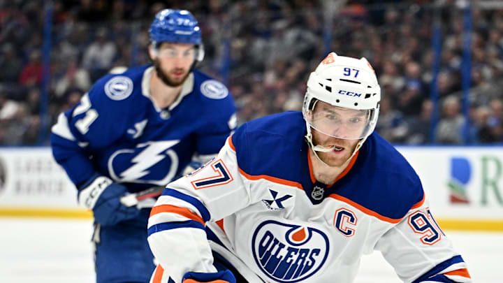 Feb 25, 2025; Tampa, Florida, USA;  Edmonton Oilers center Connor McDavid (97) controls  the puck  in the second period against the Tampa Bay Lightning  at Amalie Arena. 