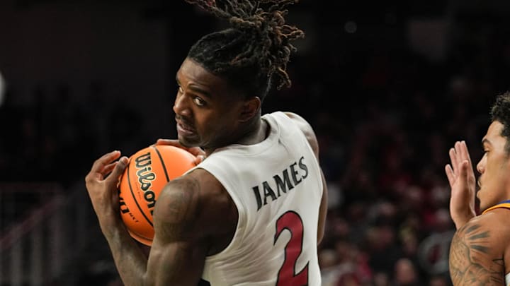 Bearcats Jizzle James (2) looks for a pass during their game against the Morehead State Eagles at Fifth Third Arena on Friday November 8, 2024. Bearcats lead the game at halftime with a score of 37-19. Bearcats Jizzle James (2) looks for a pass during their game against the Morehead State Eagles at Fifth Third Arena on Friday November 8, 2024. Bearcats lead the game at halftime with a score of 37-19.