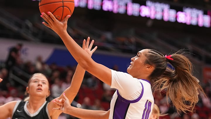 Jenica Lewis of Johnston puts up a shot as Rylyn Boeding of Ankeny Centennial defends in the quarterfinals of the Iowa girls basketball state tournament, March 2, 2026.