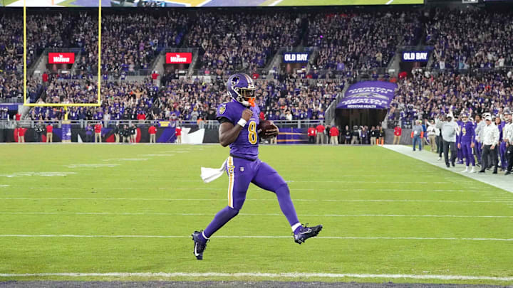 Nov 7, 2024; Baltimore, Maryland, USA; Baltimore Ravens quarterback Lamar Jackson (8) scores a two point conversion during the fourth quarter against the Cincinnati Bengals at M&T Bank Stadium. Mandatory Credit: Mitch Stringer-Imagn Images