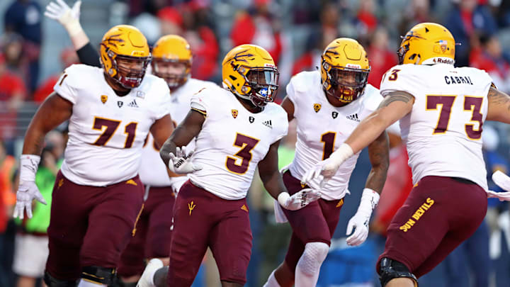Nov 24, 2018; Tucson, AZ, USA; Arizona State Sun Devils running back Eno Benjamin (3) celebrates with teammates after scoring a touchdown against the Arizona Wildcats during the Territorial Cup at Arizona Stadium. Mandatory Credit: Mark J. Rebilas-Imagn Images