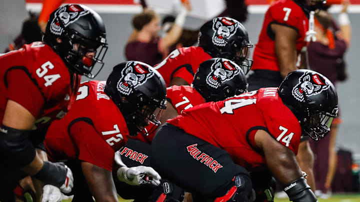 Sep 27, 2025; Raleigh, North Carolina, USA;  North Carolina State Wolfpack offensive lineman Jalen Grant (74) with the ball during the first half of the game against Virginia Tech Hokies at Carter-Finley Stadium. Mandatory Credit: Jaylynn Nash-Imagn Images