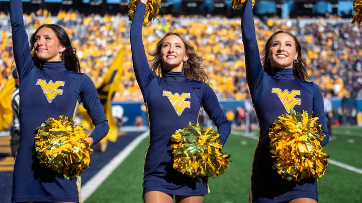 Oct 17, 2026; Morgantown, West Virginia, USA;  Members of the West Virginia Mountaineers dance team cheer during the fourth quarter against the Cincinnati Bearcats at Milan Puskar Stadium.  Mandatory Credit: Ben Queen-Imagn Images