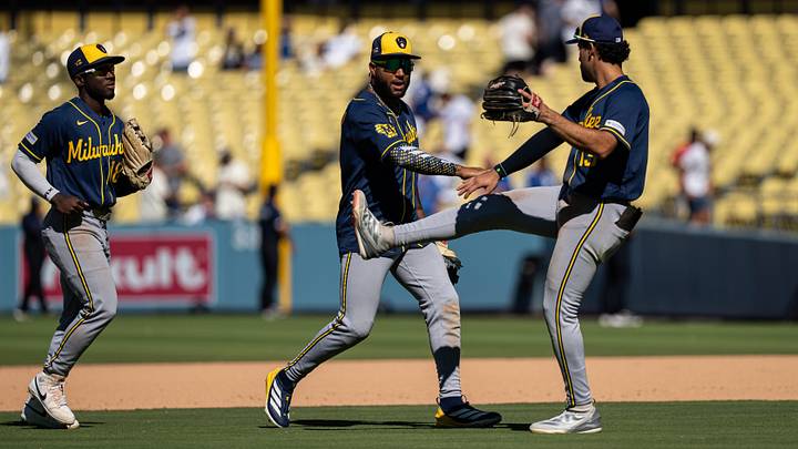 Aug 16, 2026; Los Angeles, California, USA; Milwaukee Brewers left fielder Jackson Chourio (11) and shortstop Jonathan Ornelas (13) celebrate a victory against the Los Angeles Dodgers at Dodger Stadium. Mandatory Credit: Jon Endow-Imagn Images