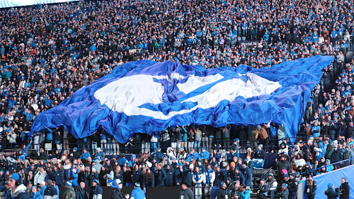 Nov 16, 2024; Provo, Utah, USA; The Brigham Young Cougars student section displays a TIFO before the fourth quarter against the Kansas Jayhawks at LaVell Edwards Stadium. Mandatory Credit: Rob Gray-Imagn Images