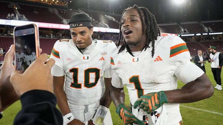 Miami Hurricanes quarterback Darian Mensah (10) and wide receiver Malachi Toney (1) on the field after defeating the Stanford Cardinal at Stanford Stadium.