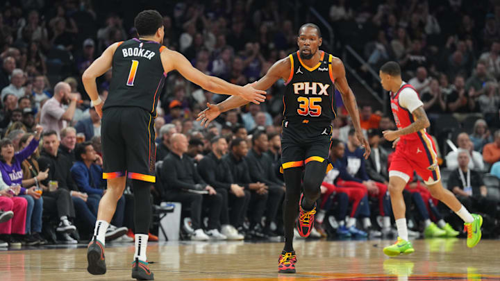 Feb 28, 2025; Phoenix, Arizona, USA; Phoenix Suns forward Kevin Durant (35) and Phoenix Suns guard Devin Booker (1) slap hands against the New Orleans Pelicans during the first half at Footprint Center. Mandatory Credit: Joe Camporeale-Imagn Images Feb 28, 2025; Phoenix, Arizona, USA; Phoenix Suns forward Kevin Durant (35) and Phoenix Suns guard Devin Booker (1) slap hands against the New Orleans Pelicans during the first half at Footprint Center. Mandatory Credit: Joe Camporeale-Imagn Images