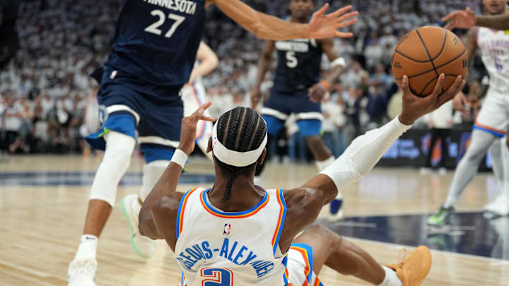 Shai Gilgeous-Alexander throws the ball away in the final seconds of the Thunder’s win over the Timberwolves.