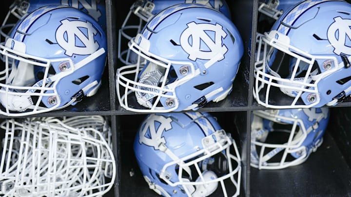 Sep 2, 2023; Charlotte, North Carolina, USA; North Carolina Tar Heels helmets during the first quarter against the South Carolina Gamecocks at Bank of America Stadium. Mandatory Credit: Jim Dedmon-Imagn Images Sep 2, 2023; Charlotte, North Carolina, USA; North Carolina Tar Heels helmets during the first quarter against the South Carolina Gamecocks at Bank of America Stadium. Mandatory Credit: Jim Dedmon-Imagn Images