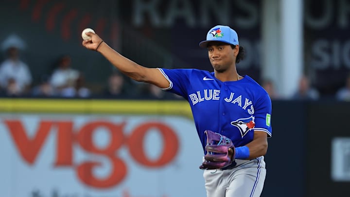 Mar 11, 2026; Tampa, Florida, USA;  Toronto Blue Jays infielder Arjun Nimmala (18) throws the ball to first base for an out during the third inning against the New York Yankees at George M. Steinbrenner Field. Mandatory Credit: Kim Klement Neitzel-Imagn Images