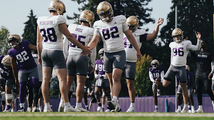 Former UW snapper Caleb Johnston (82) shakes hands with punter Jack McCallister, who have transferred to Cal and Nebraska. Former UW snapper Caleb Johnston (82) shakes hands with punter Jack McCallister, who have transferred to Cal and Nebraska.