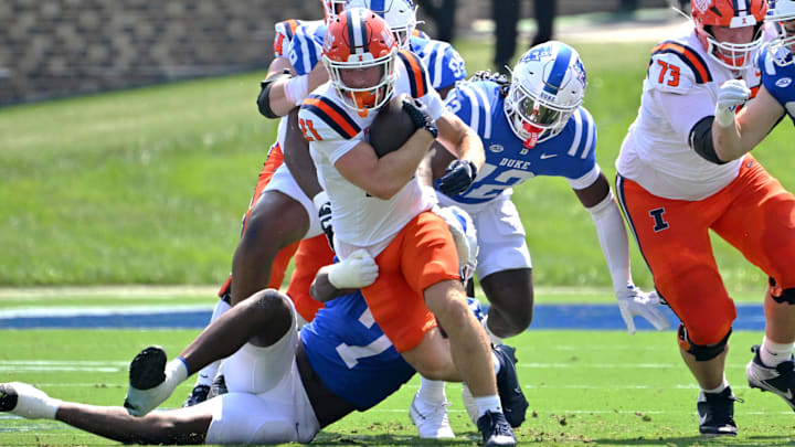 Sep 6, 2025; Durham, North Carolina, USA; Illinois Fighting Illini Aidan Laughery (21) runs against Duke Blue Devils defensive end Vincent Anthony Jr. (7) during the first quarter at Wallace Wade Stadium. Mandatory Credit: Zachary Taft-Imagn Images Sep 6, 2025; Durham, North Carolina, USA; Illinois Fighting Illini Aidan Laughery (21) runs against Duke Blue Devils defensive end Vincent Anthony Jr. (7) during the first quarter at Wallace Wade Stadium. Mandatory Credit: Zachary Taft-Imagn Images