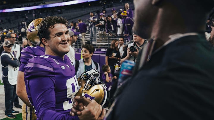 Grady Gross accepts congratulations after a Husky game.
